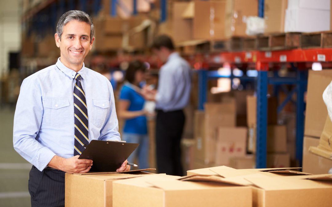Manager In Warehouse Checking Boxes http://www.gaylordlogistics.com