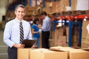 Manager In Warehouse Checking Boxes https://www.gaylordlogistics.com